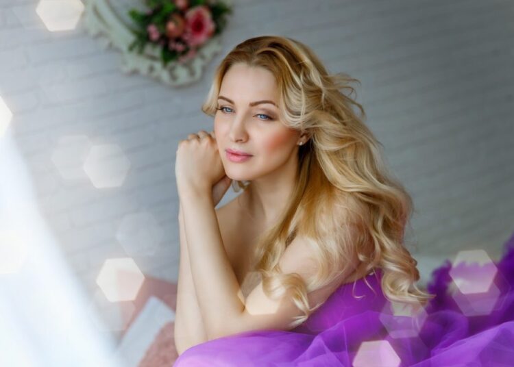 žena