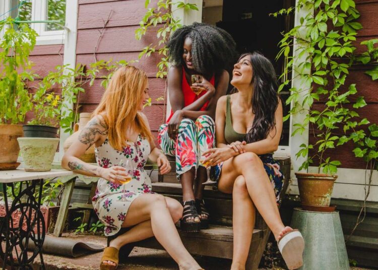 sazenicka friends laughing with wine glasses